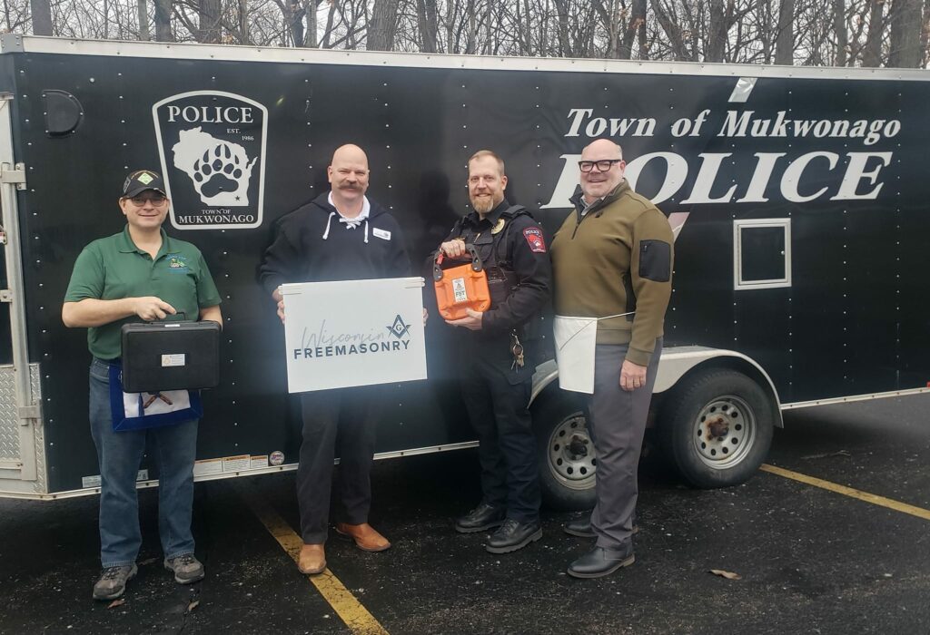 Town of Mukwonago Police Department Chief Thomas Czarnecki accepted the donations on behalf of his team, and Jim Cairo (the leader of our Mukwonago Lodge), and Gavin DeGrave (our District leader) joined me for the presentation. 